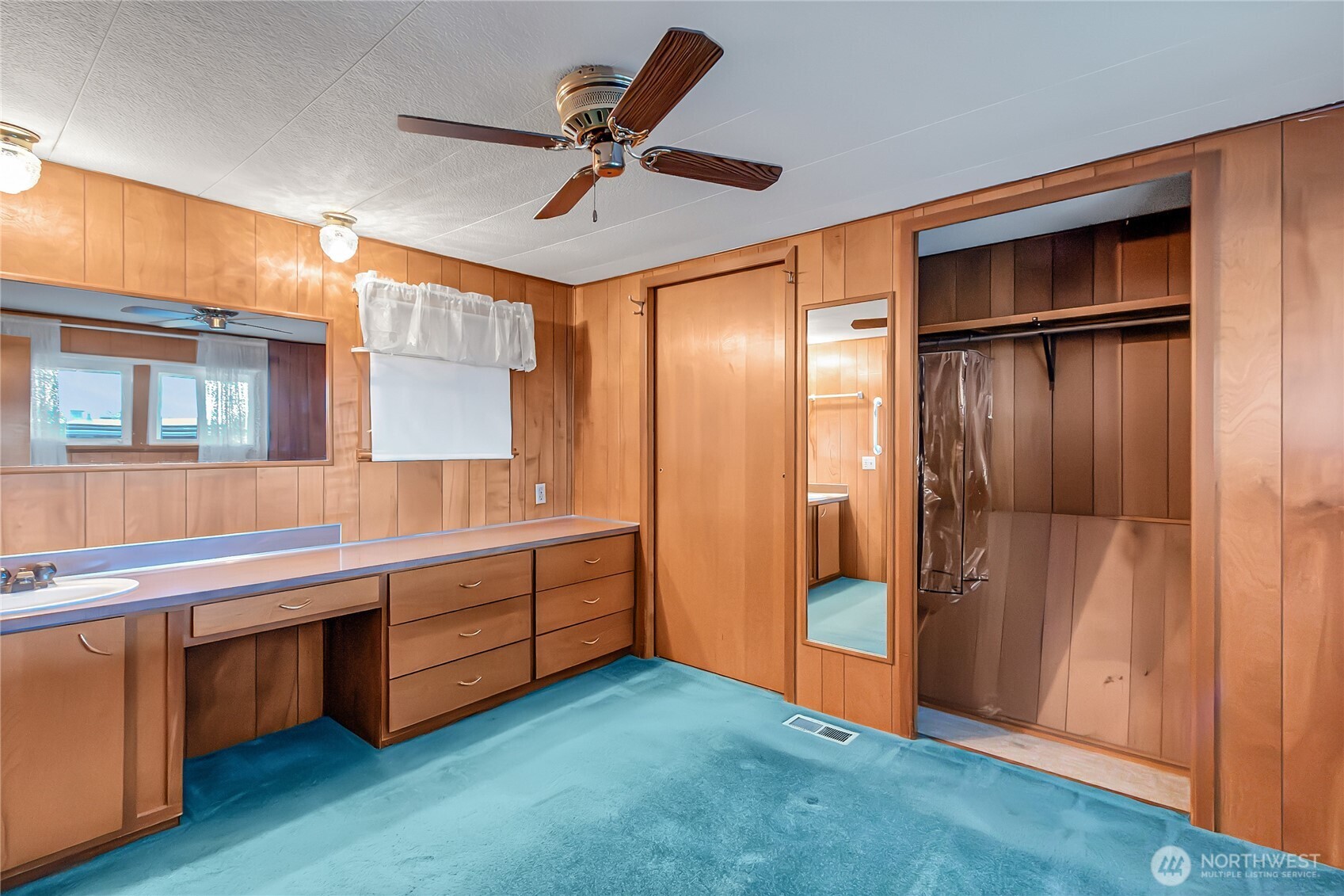 9314 Canyon Road East, Unit 34 Puyallup, WA 98371 - Photo 16 of 18 a room with bed and wooden floors