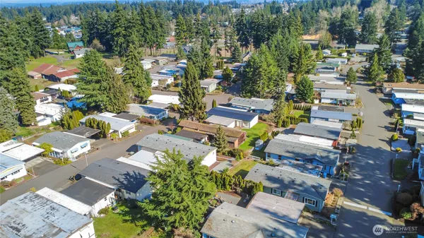 an aerial view of a houses with yard