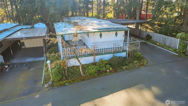 a view of a balcony with wooden floor