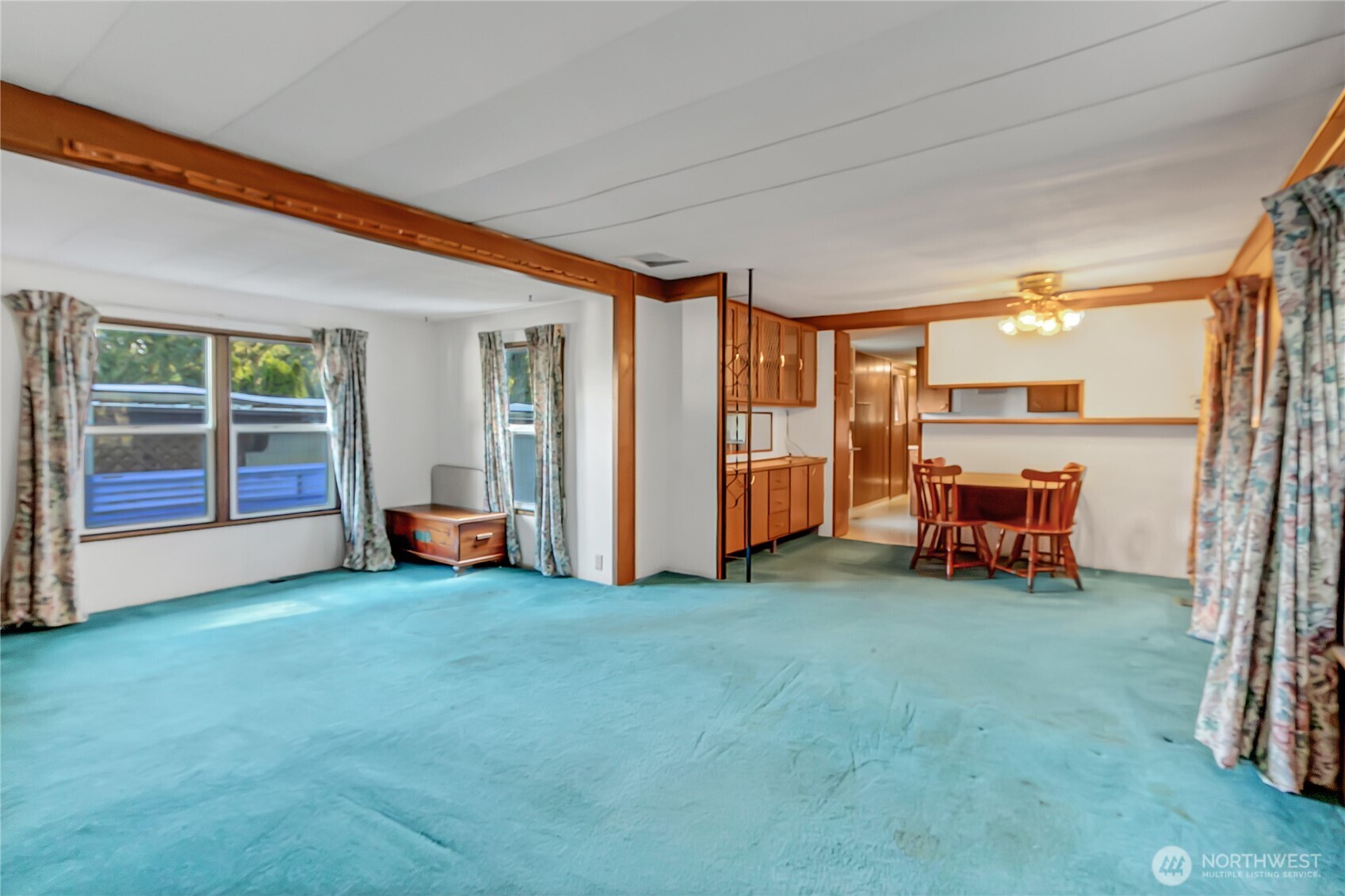 9314 Canyon Road East, Unit 34 Puyallup, WA 98371 - Photo 8 of 18 a living room with furniture and a large window