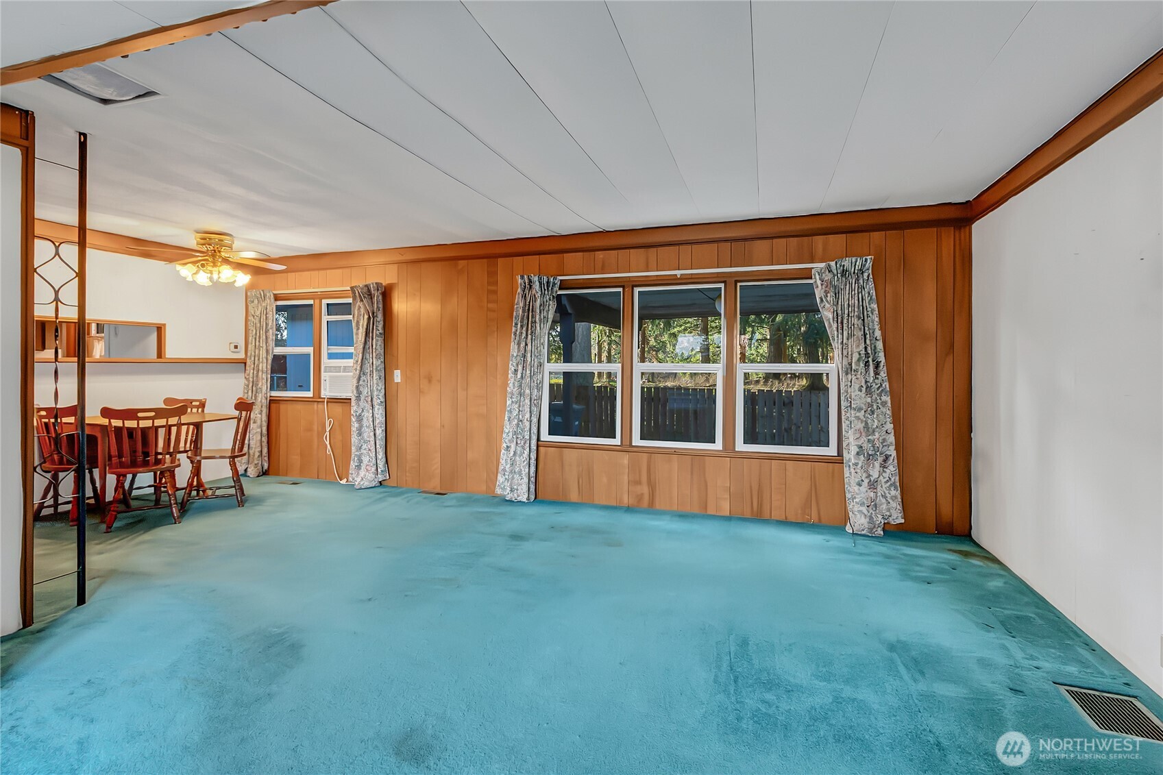 9314 Canyon Road East, Unit 34 Puyallup, WA 98371 - Photo 9 of 18 a view of an empty room with a window