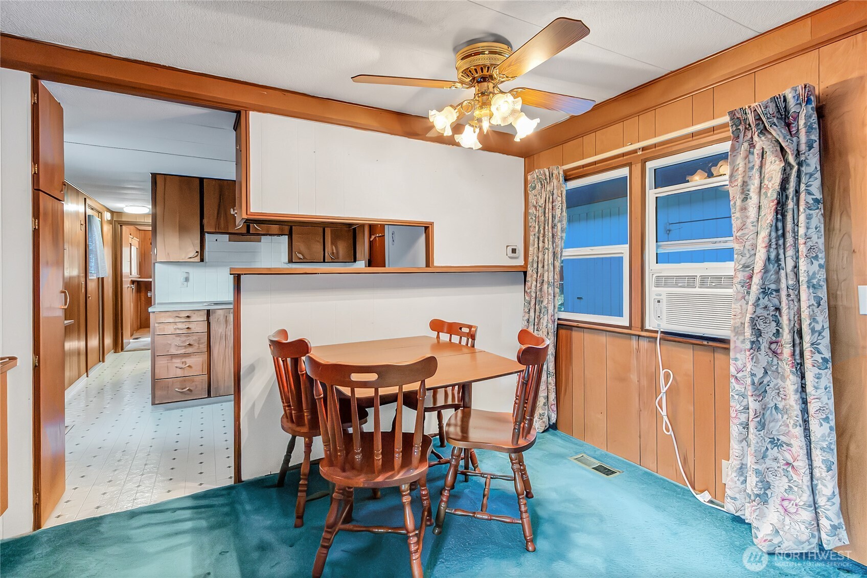 9314 Canyon Road East, Unit 34 Puyallup, WA 98371 - Photo 10 of 18 a dining room with furniture and window