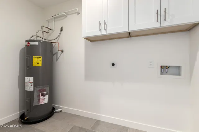 a view of storage and utility room with wooden floor