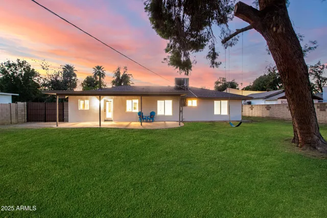 a view of a house with a yard