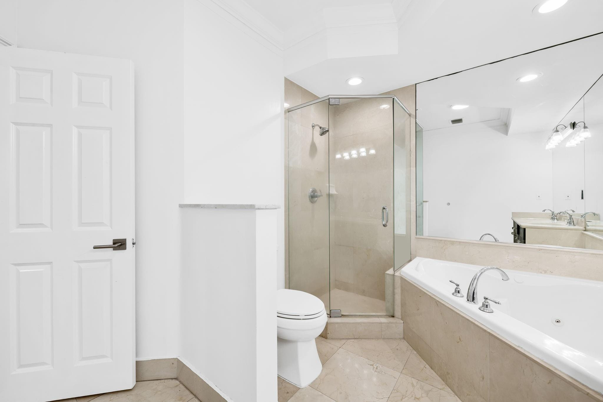456 East Boca Raton Road Boca Raton, FL 33432 - Photo 30 of 33 a bathroom with a bathtub shower sink vanity and toilet