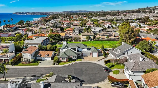an aerial view of a house with outdoor space