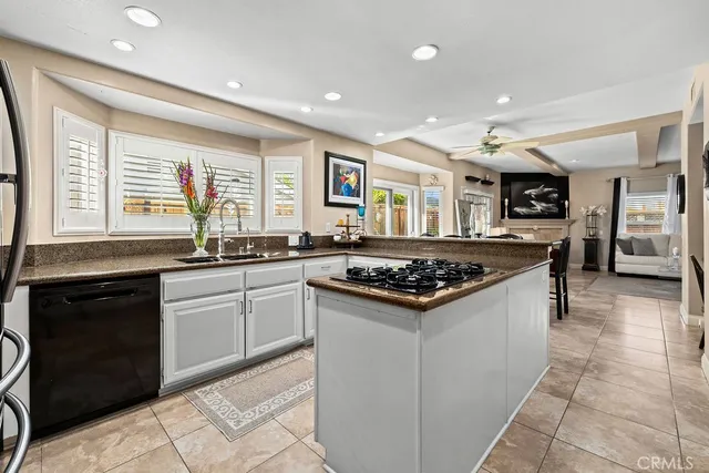 a kitchen with stainless steel appliances granite countertop a stove and a sink