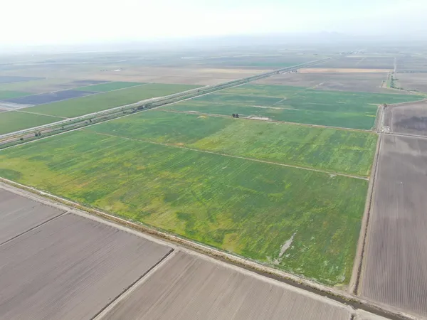 a view of a field with an outdoor space