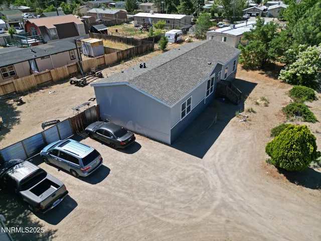 an aerial view of a house with roof deck