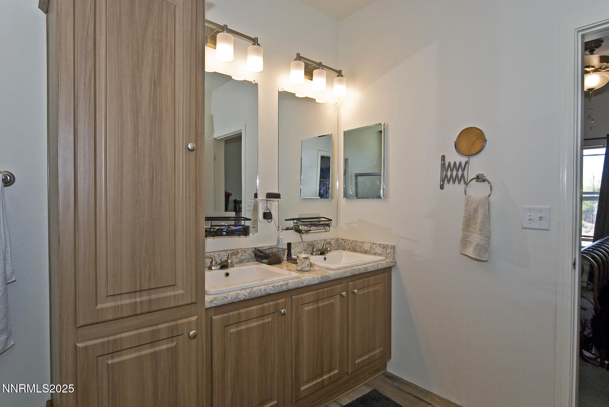 3800 Sandpiper Drive Reno, NV 89508 - Photo 2 of 18 a bathroom with a sink vanity and mirror