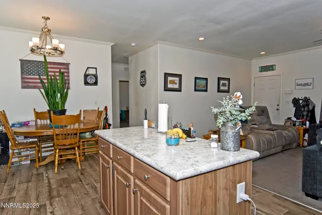 a dining room with a table and chairs