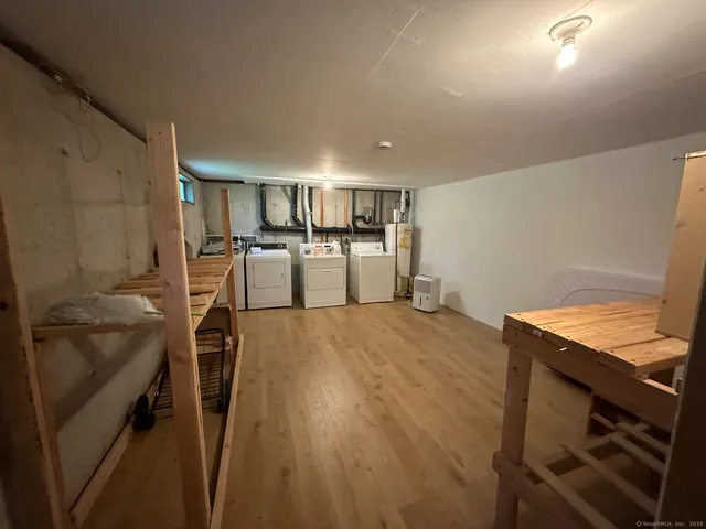 a kitchen with a sink appliances and cabinets