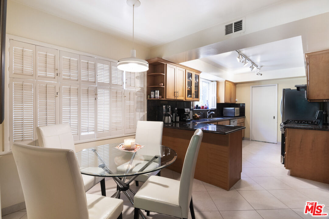 9527 Oakmore Road Los Angeles, CA 90035 - Photo 12 of 29 a view of a dining room with furniture