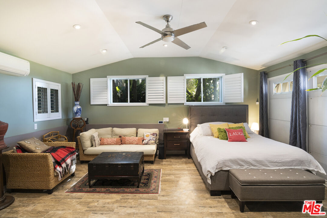 9527 Oakmore Road Los Angeles, CA 90035 - Photo 20 of 29 a bedroom with a bed couch and window