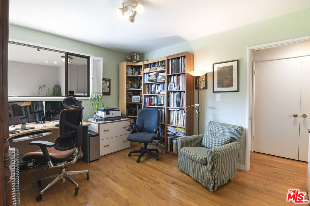 9527 Oakmore Road Los Angeles, CA 90035 - Photo 24 of 29 a livingroom with workspace and a couch