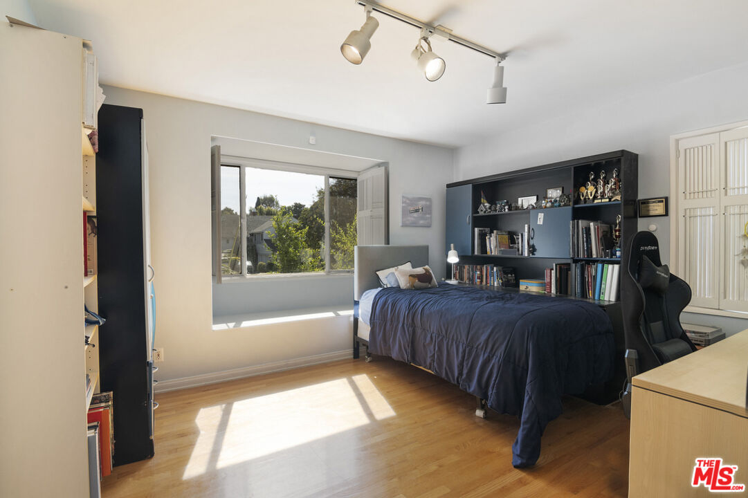9527 Oakmore Road Los Angeles, CA 90035 - Photo 25 of 29 a living room with furniture and a window