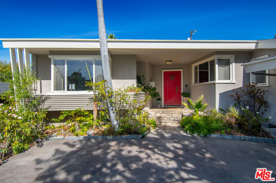 9527 Oakmore Road Los Angeles, CA 90035 - Photo 3 of 29 a view of a house with potted plants