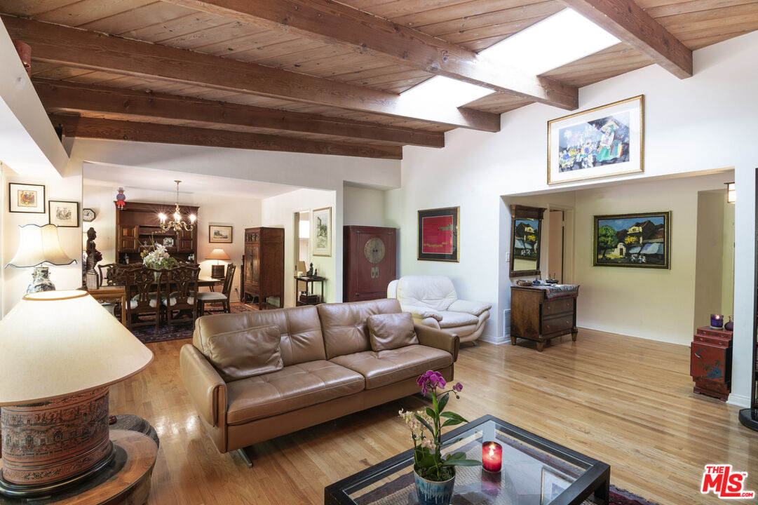 9527 Oakmore Road Los Angeles, CA 90035 - Photo 5 of 29 a living room with furniture and wooden floor
