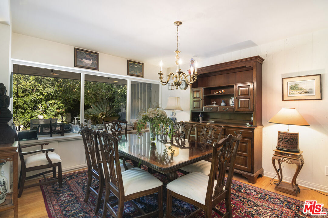 9527 Oakmore Road Los Angeles, CA 90035 - Photo 8 of 29 a view of a dining room with furniture window and outside view