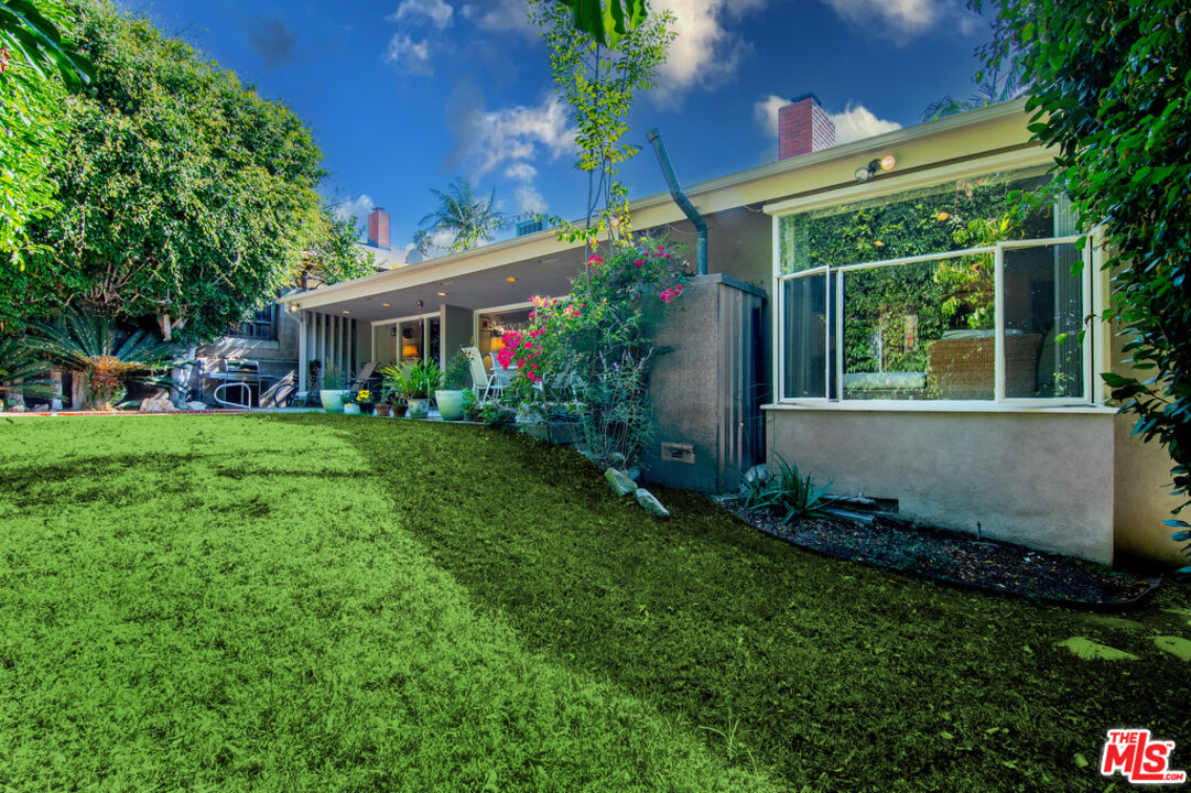 9527 Oakmore Road Los Angeles, CA 90035 - Photo 10 of 29 a view of a house with backyard and garden