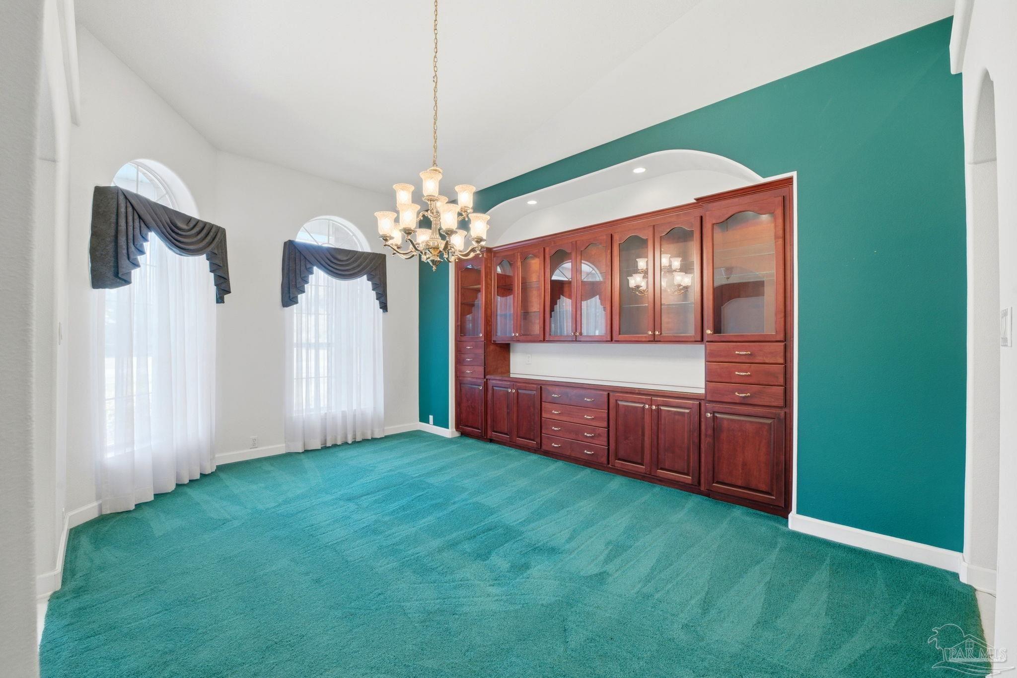 4552 Peaden Road Pace, FL 32571 - Photo 9 of 38 a view of an empty room with a kitchen