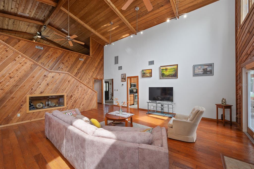 7201 Southwest 97th Lane Gainesville, FL 32608 - Photo 14 of 68 a living room with furniture and a fireplace