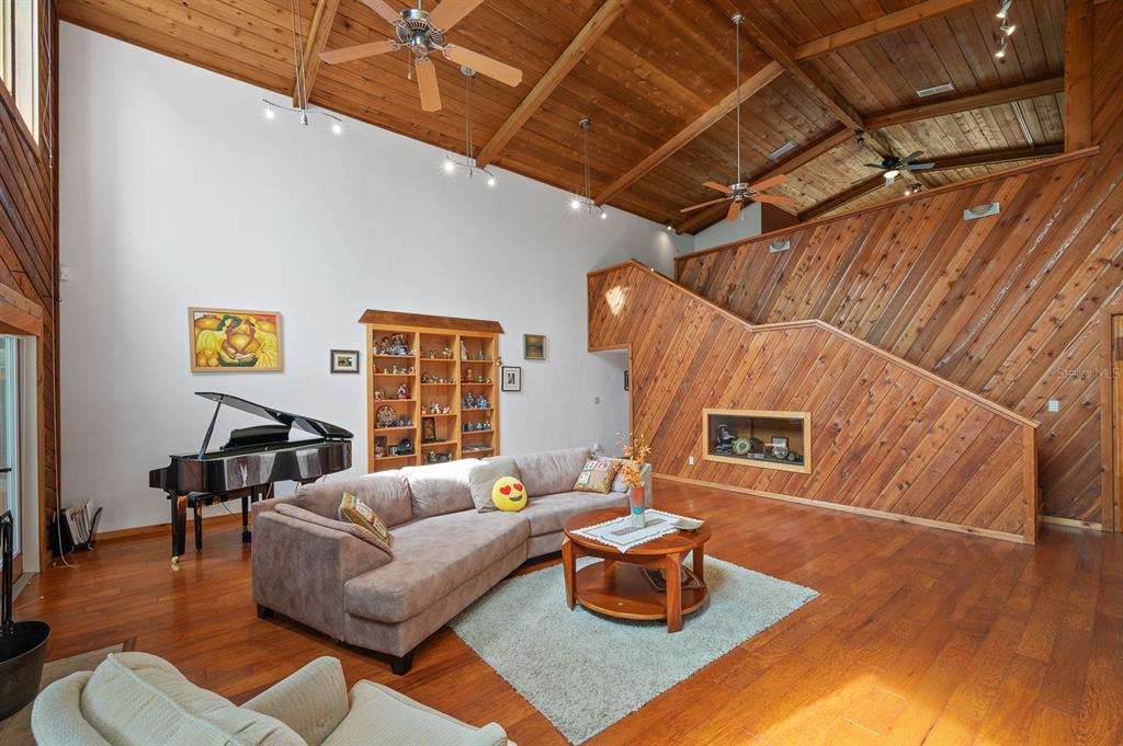 7201 Southwest 97th Lane Gainesville, FL 32608 - Photo 15 of 68 a living room with furniture and a wooden floor