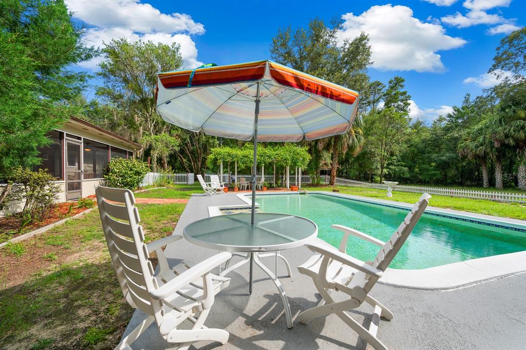 7201 Southwest 97th Lane Gainesville, FL 32608 - Photo 3 of 68 a view of a swimming pool with a patio