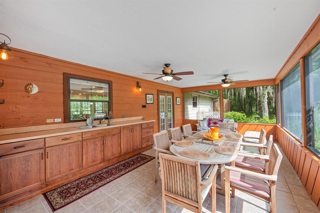 7201 Southwest 97th Lane Gainesville, FL 32608 - Photo 44 of 68 a view of a dining room with furniture window and outside view