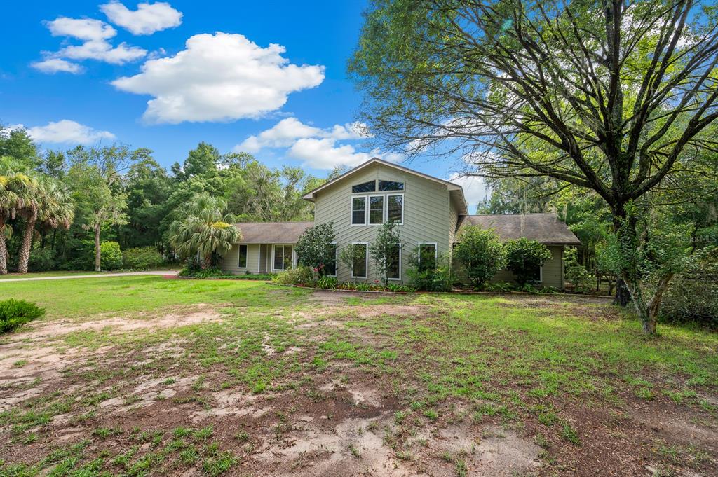 7201 Southwest 97th Lane Gainesville, FL 32608 - Photo 5 of 68 a view of a house with a yard