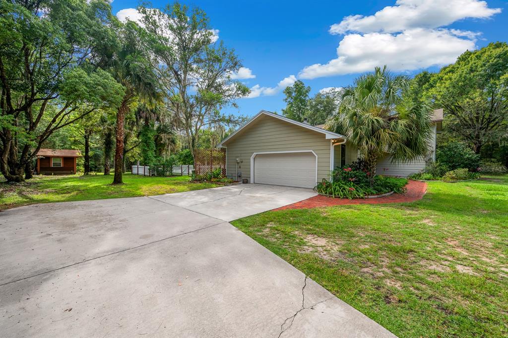 7201 Southwest 97th Lane Gainesville, FL 32608 - Photo 58 of 68 a front view of a house with garden