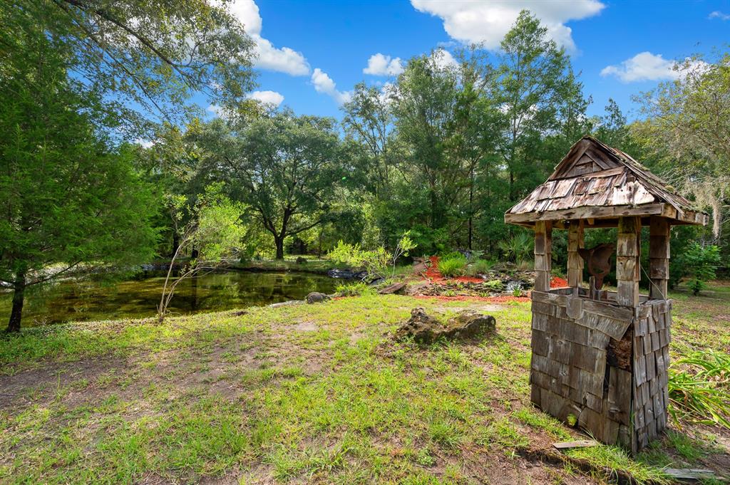 7201 Southwest 97th Lane Gainesville, FL 32608 - Photo 61 of 68 a backyard of a house with yard and trampoline