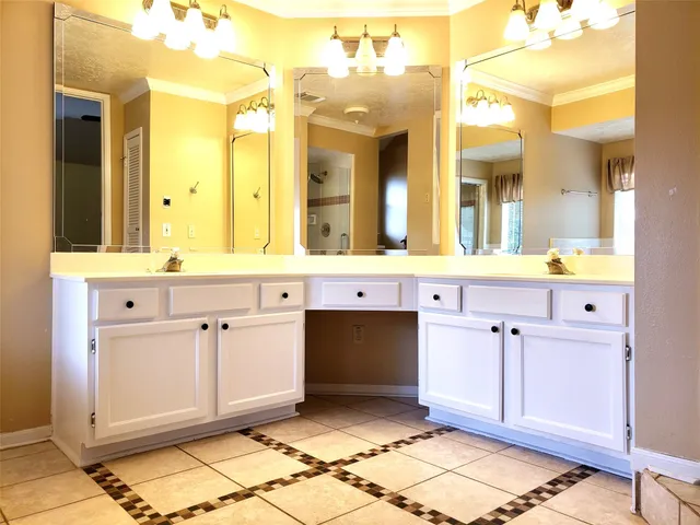 a view of a hallway with wooden floor and entryway