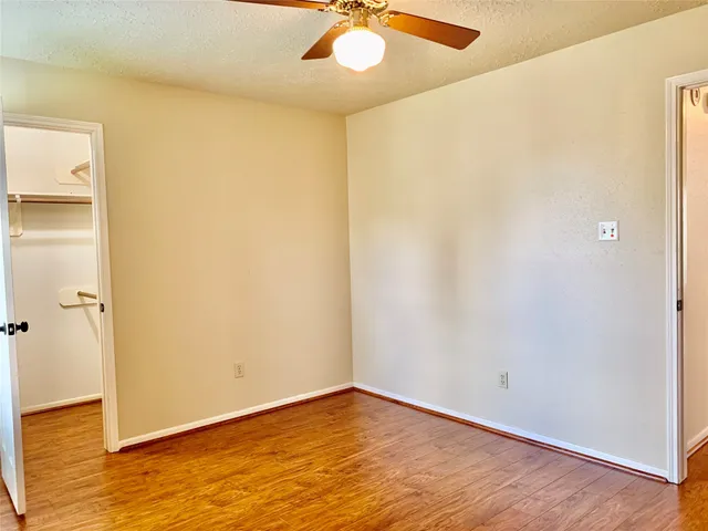 a view of a deck with wooden floor and fence