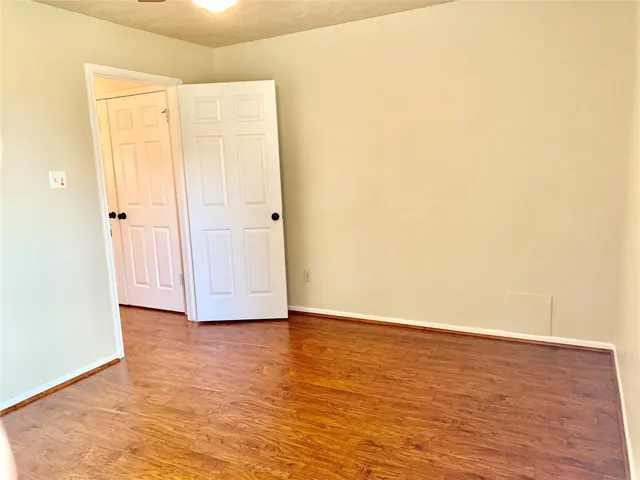a view of a patio with a table chairs and a backyard