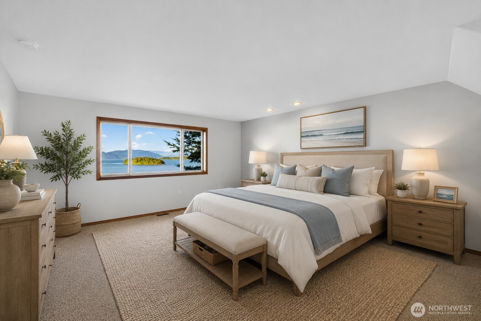 4623 Guemes Island Road Anacortes, WA 98221 - Photo 14 of 40 a spacious bedroom with a bed and a potted plant