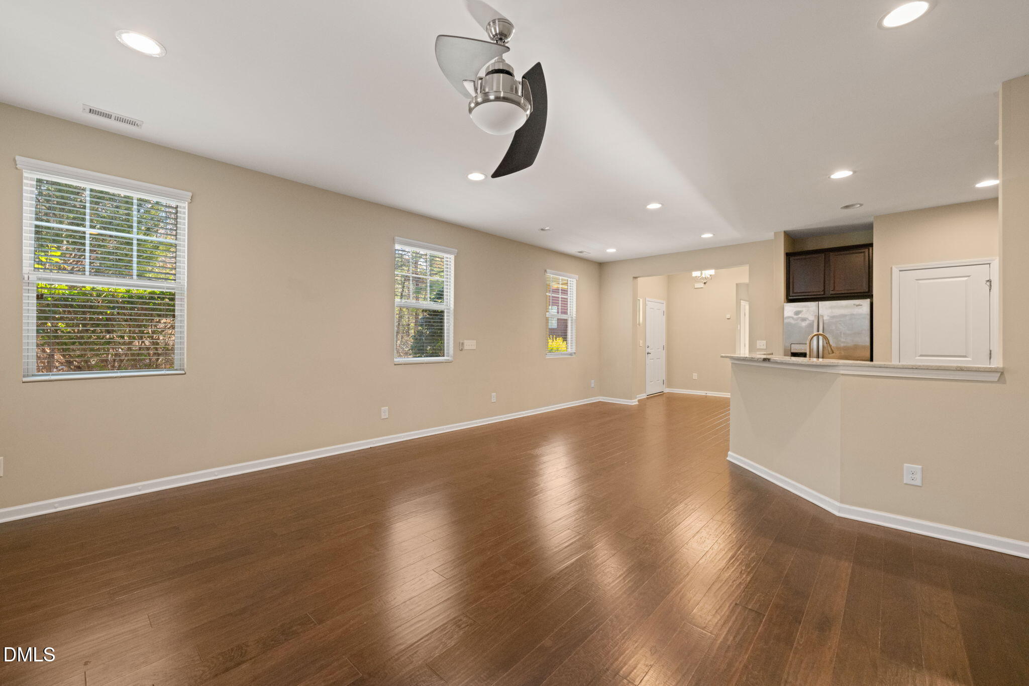 502 Libson Street Durham, NC 27703 - Photo 13 of 43 a view of an empty room with wooden floor and a window