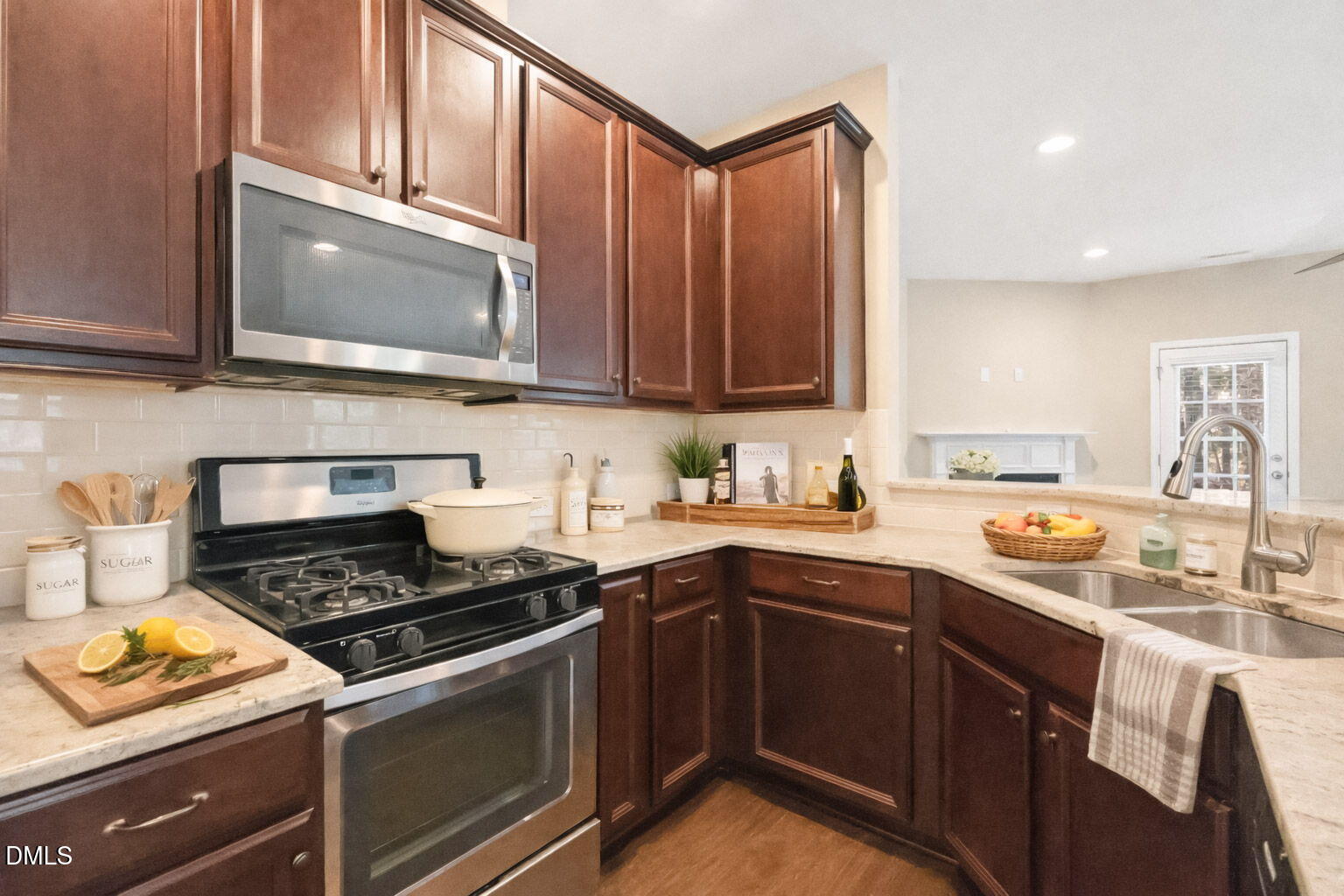 502 Libson Street Durham, NC 27703 - Photo 14 of 43 a kitchen with stainless steel appliances granite countertop a sink stove microwave and cabinets