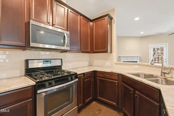 a kitchen with a sink and a window