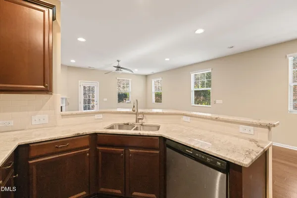 a kitchen with a refrigerator and cabinets