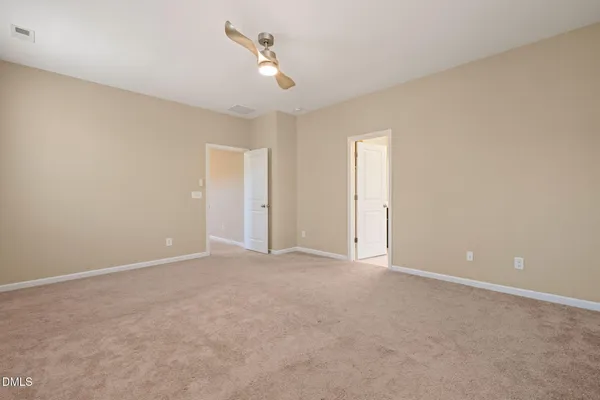 an empty room with closet area