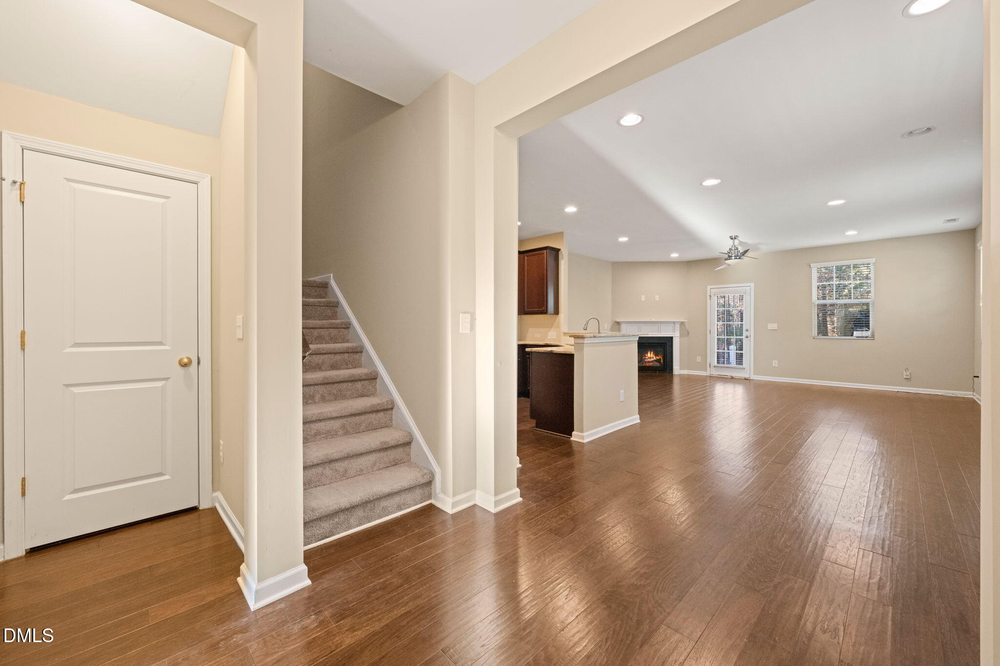 502 Libson Street Durham, NC 27703 - Photo 5 of 43 a view of a hallway with wooden floor kitchen view and a window