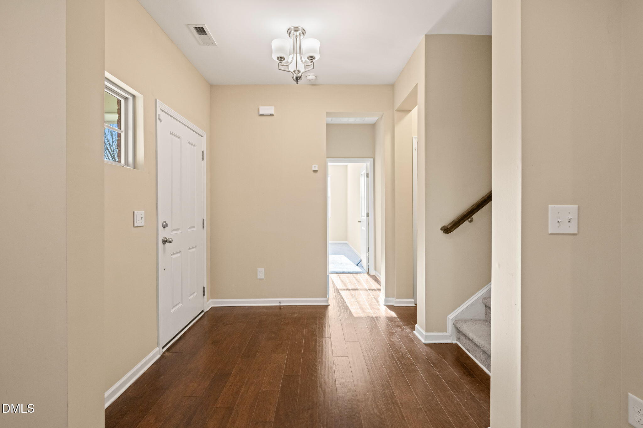 502 Libson Street Durham, NC 27703 - Photo 6 of 43 a view of a hallway with wooden floor and staircase