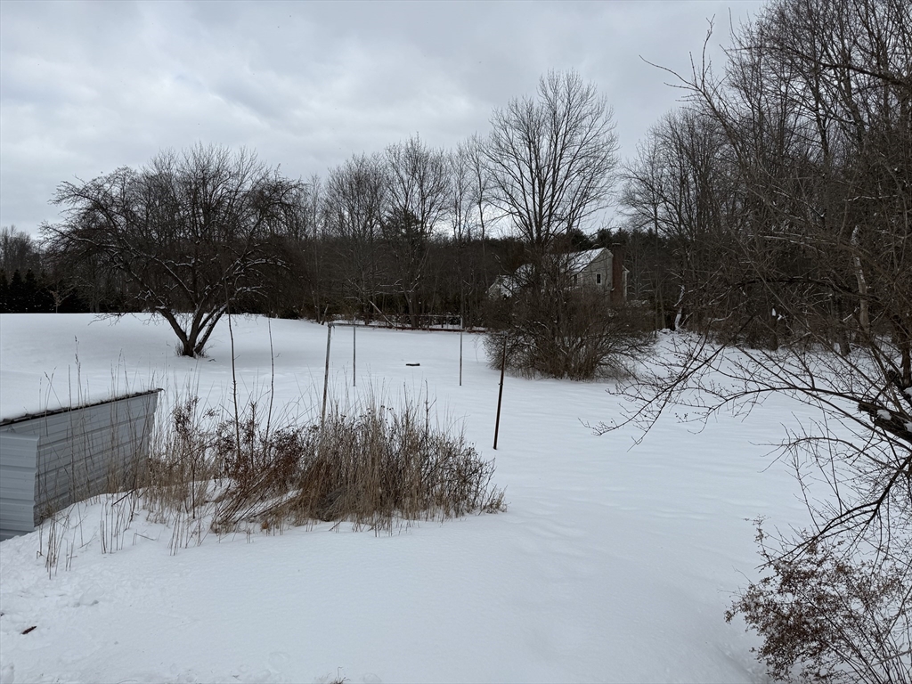 1 Barre Rd Cutoff Hubbardston, MA 01452 - Photo 4 of 41 a view of a yard covered in snow
