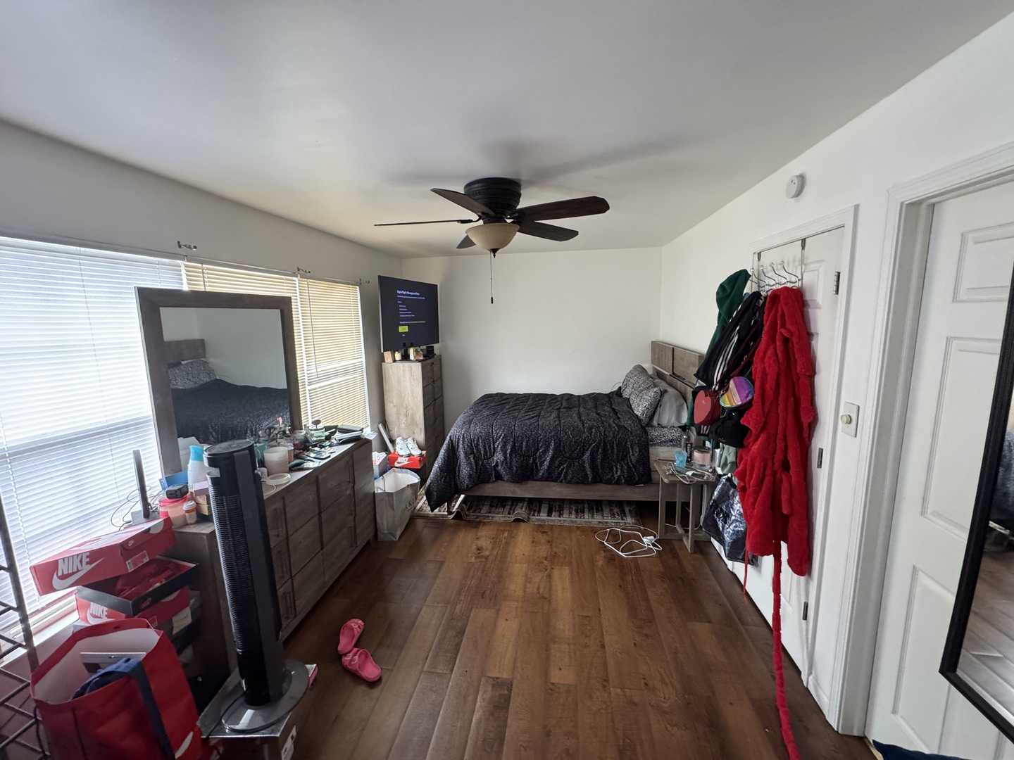 2605 East Martha Place Chicago, IL 60633 - Photo 7 of 10 a living room with furniture a flat screen tv and a ceiling fan