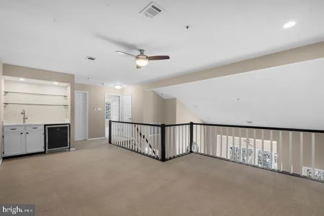 a view of an empty room with a fireplace