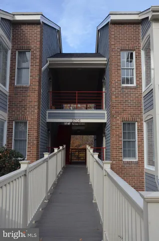 a view of a house with roof and deck