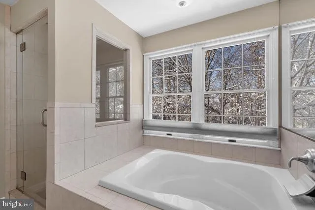 a bath tub sitting next to a window