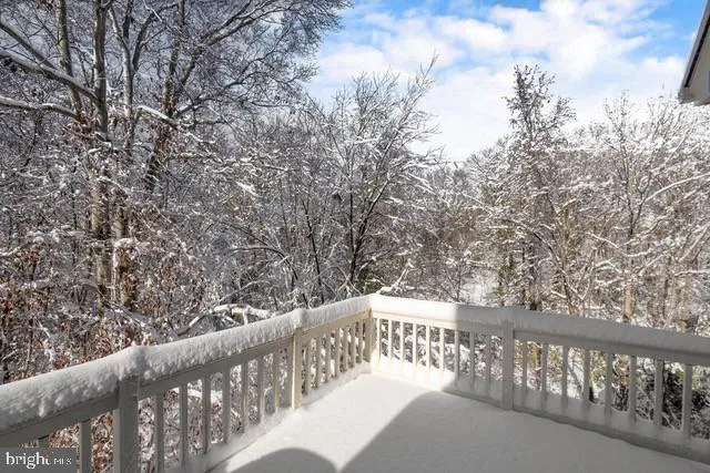 a view of a balcony with wooden fence