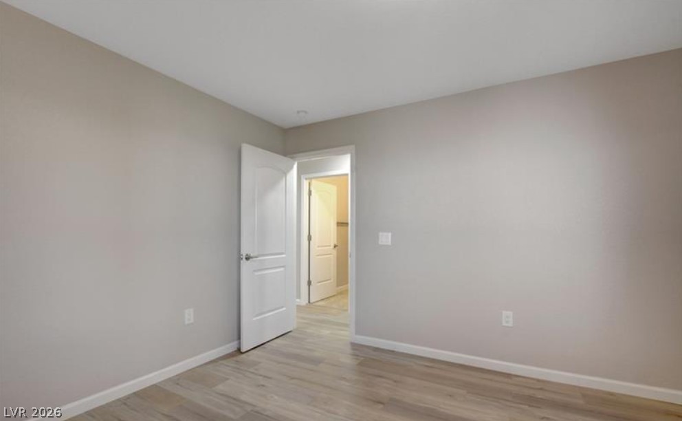 2716 Showcase Drive Las Vegas, NV 89134 - Photo 21 of 45 A spacious room offers comfortable living with modern flooring and ample natural light.